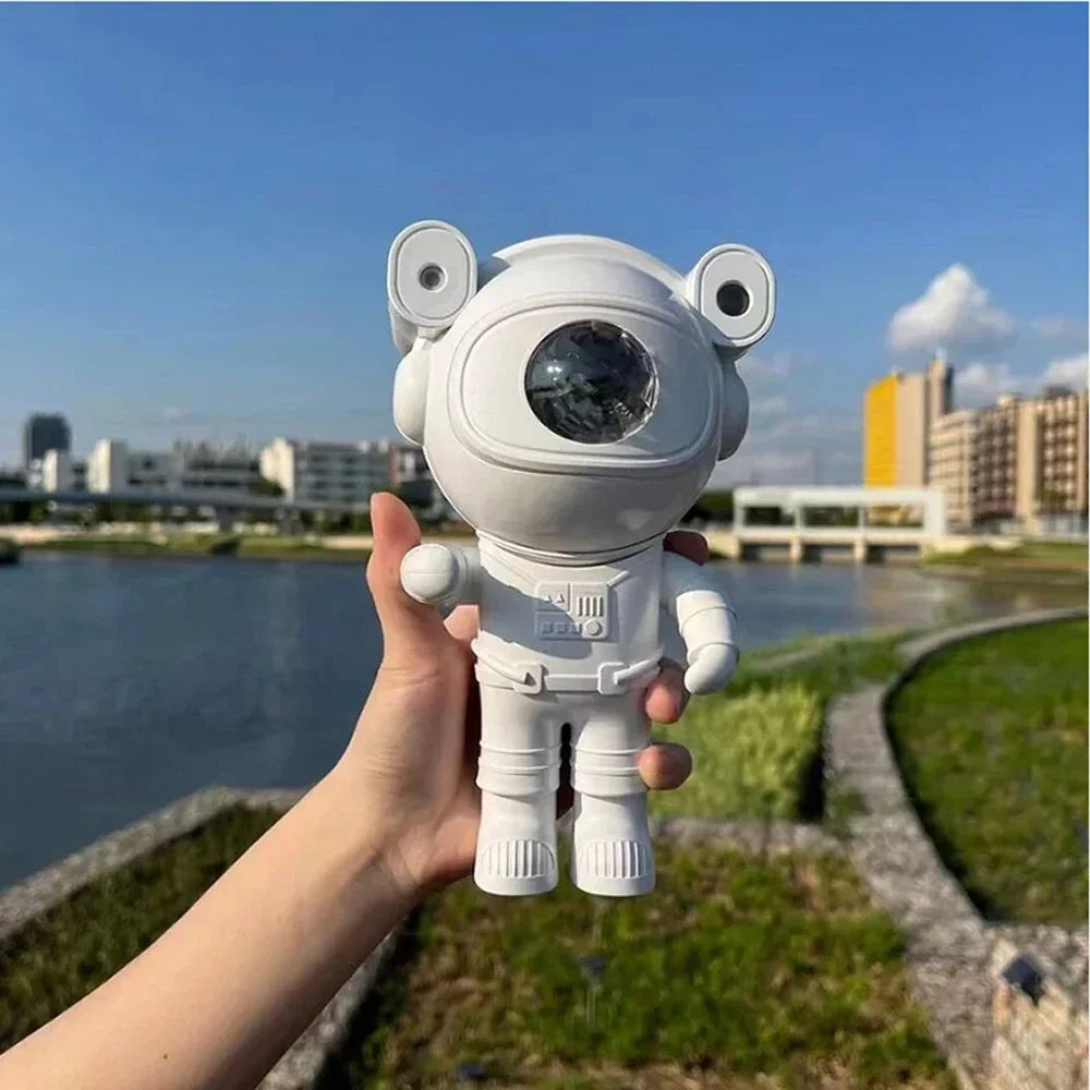 Astronauta proyector de galaxia